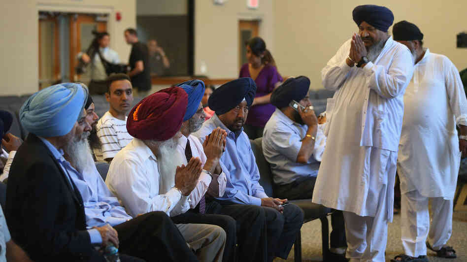 Members of the Milwaukee-area Sikh community gather Monday in Oak Creek, Wis., to learn more information about a shooting spree that left six people dead. Sikhs have faced a number of attacks in the U.S. in recent years. Members of the Milwaukee-area Sikh community gather Monday in Oak Creek, Wis., to learn more information about a shooting spree that left six people dead. Sikhs have faced a number of attacks in the U.S. in recent years.