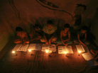 Muslim girls study by candlelight inside a religious school in Noida, near New Delhi, on July 31. The collapse of three regional power grids last week caused a massive power outage that blacked out more than half of India. Muslim girls study by candlelight inside a religious school in Noida, near New Delhi, on July 31. The collapse of three regional power grids last week caused a massive power outage that blacked out more than half of India.