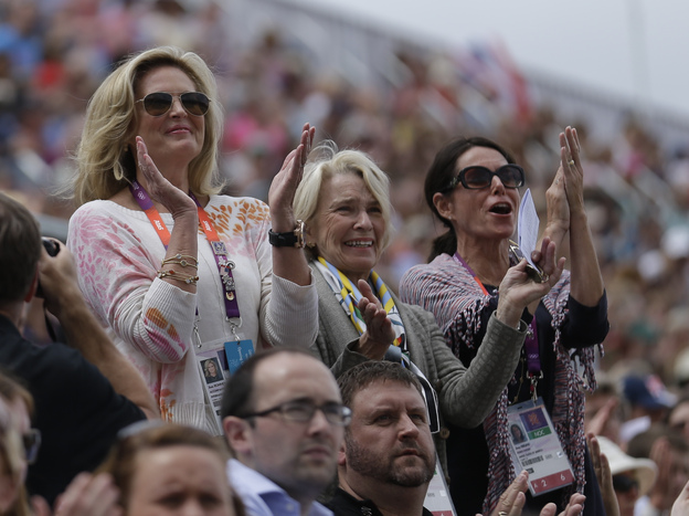 Rafalca's owners, Ann Romney (from left), Elisabeth Meyer and Amy Eberling, applaud after their horse's performance in the equestrian dressage competition at the Summer Olympics on Aug. 2.