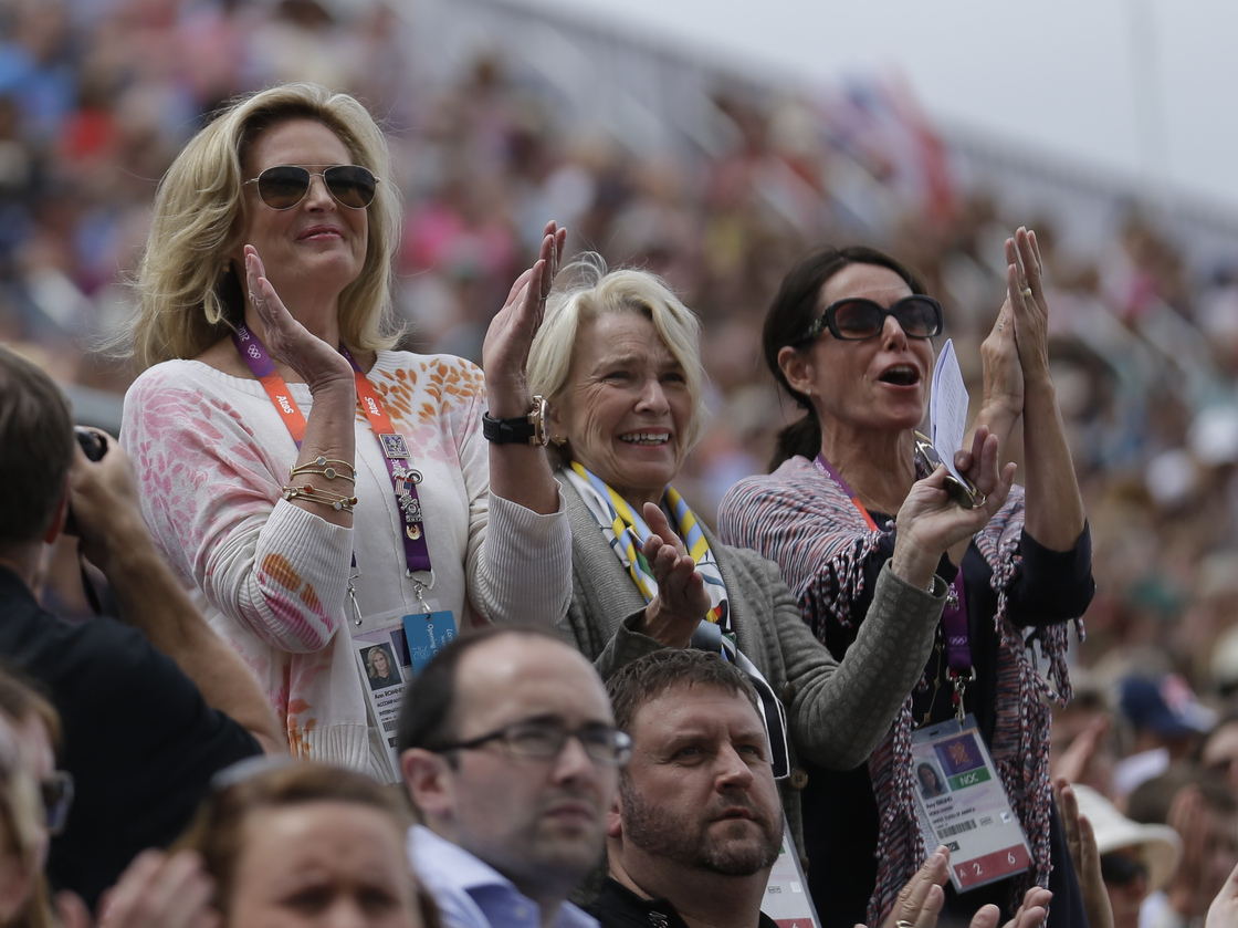 Rafalca's owners, Ann Romney (from left), Elisabeth Meyer and Amy Eberling, applaud after their horse's performance in the equestrian dressage competition at the Summer Olympics on Aug. 2.