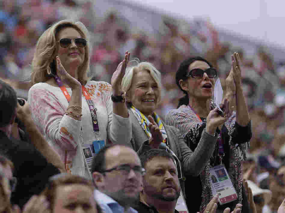 Rafalca's owners, Ann Romney (from left), Elisabeth Meyer and Amy Eberling, applaud after their horse's performance in the equestrian dressage competition at the Summer Olympics on Aug. 2.