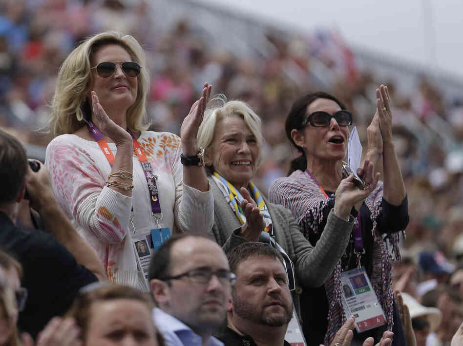 Rafalca's owners, Ann Romney (from left), Elisabeth Meyer and Amy Eberling, applaud after their horse's performance in the equestrian dressage competition at the Summer Olympics on Aug. 2.