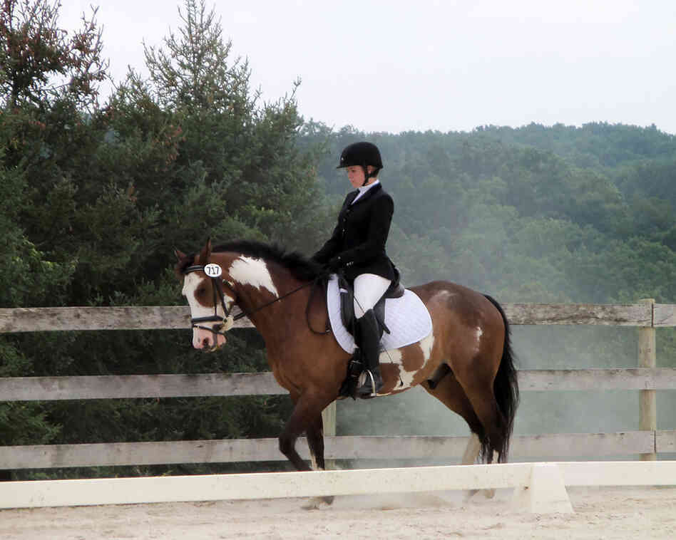 College student Celia Rozanski rides Jasper at a horse show sponsored by the Potomac Valley Dressage Association.