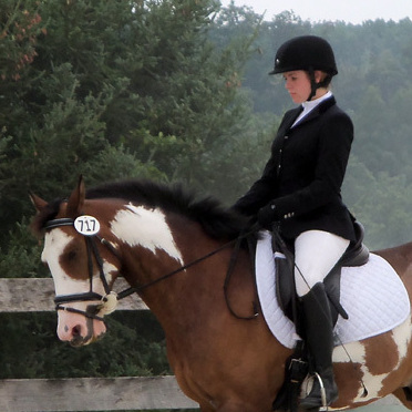 College student Celia Rozanski rides Jasper at a horse show sponsored by the Potomac Valley Dressage Association.