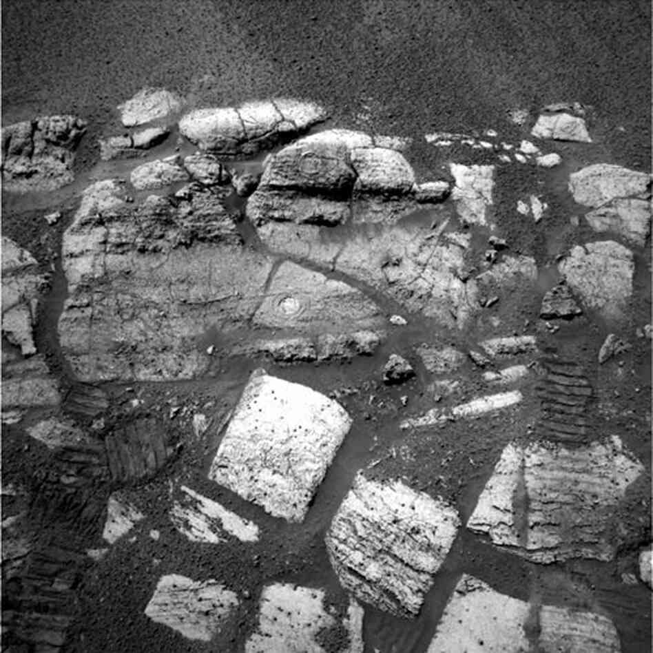 Opportunity captures the layered rocks of the "El Capitan" area near the rover's landing site at Meridiani Planum, 2004. (Visible on two of the rocks are the holes drilled by the rover, which provided scientists with a window to this part of the red planet's water-soaked past.)