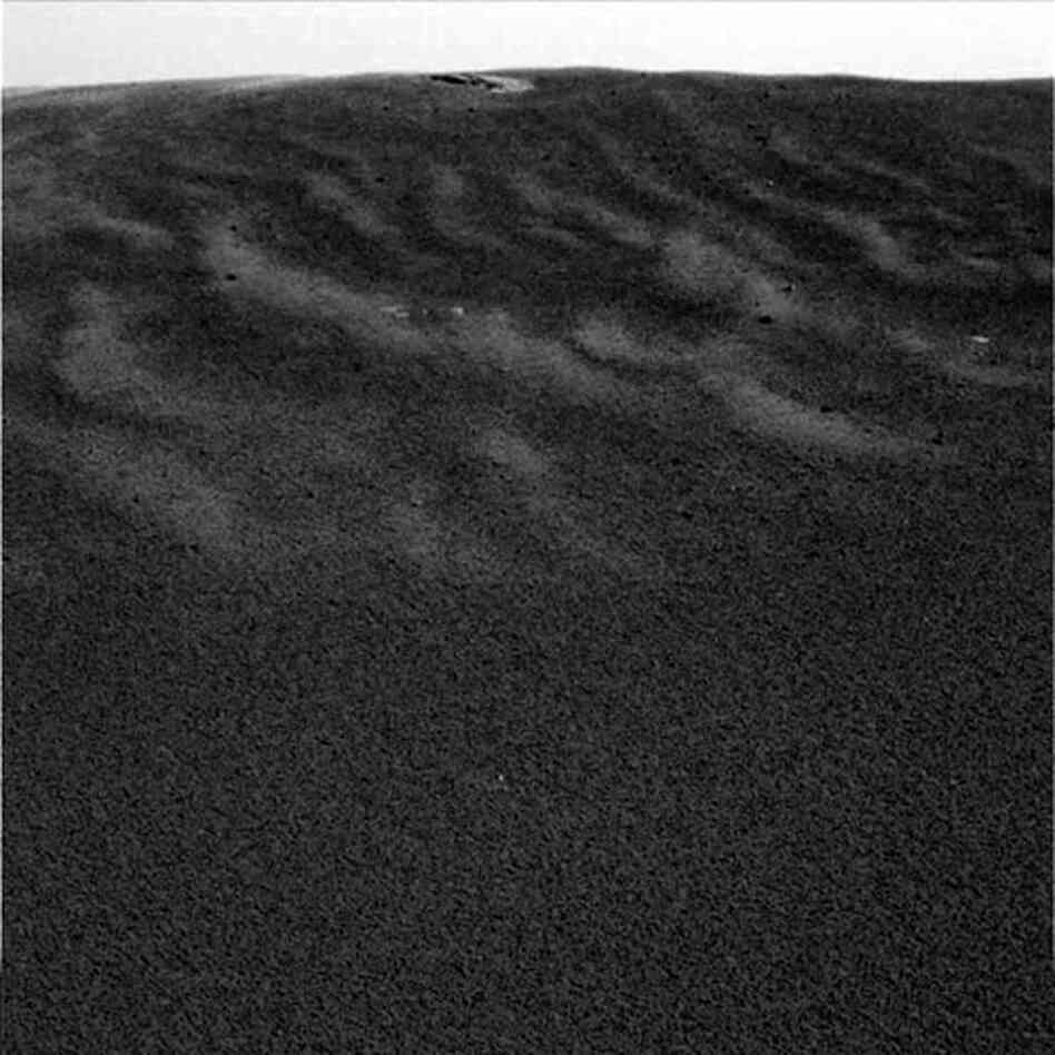 This image shows one of Opportunity's first views of the Martian soil after its successful landing at Meridiani Planum, 2004.