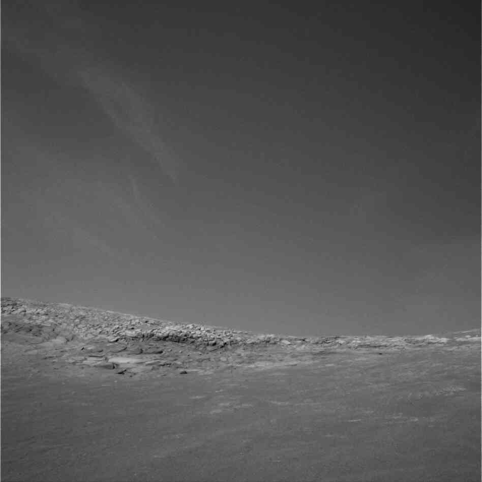Winter clouds — again, almost Earthly — drift across the skies at Endurance Crater, 2004.