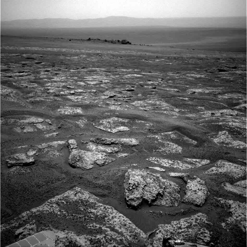 This image from Opportunity shows the view ahead on the day before the rover reached the rim of Endeavour crater. It was taken during the 2,680th sol of the rover's work on Mars.