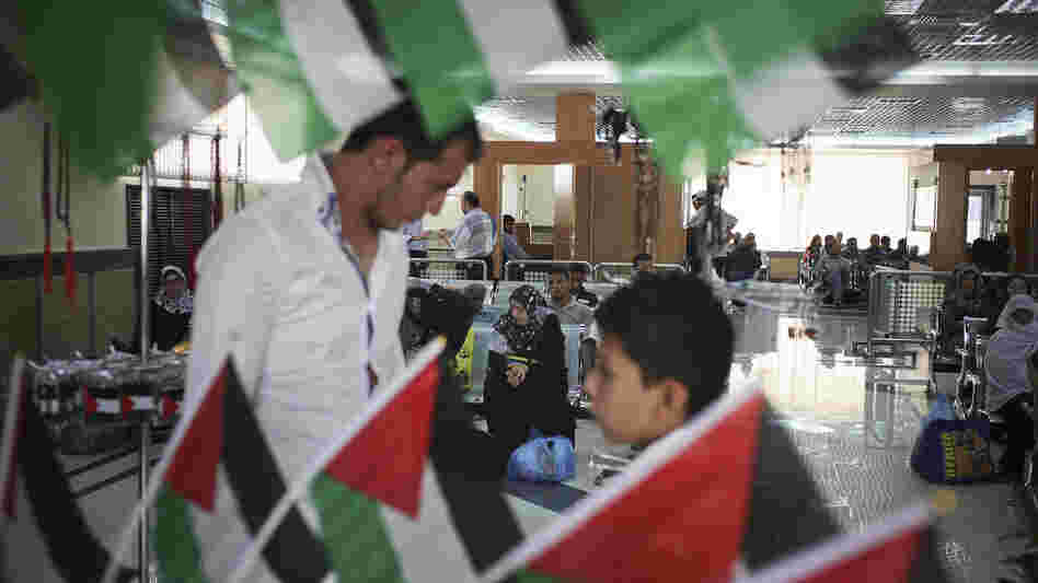 Palestinians look at items in a gift shop as they wait to cross into Egypt at the Rafah border crossing in the Gaza Strip last month. Egypt shut down the crossing less than a week later, after a deadly attack near Rafah left 16 Egyptian soldiers dead. Palestinians look at items in a gift shop as they wait to cross into Egypt at the Rafah border crossing in the Gaza Strip last month. Egypt shut down the crossing less than a week later, after a deadly attack near Rafah left 16 Egyptian soldiers dead.