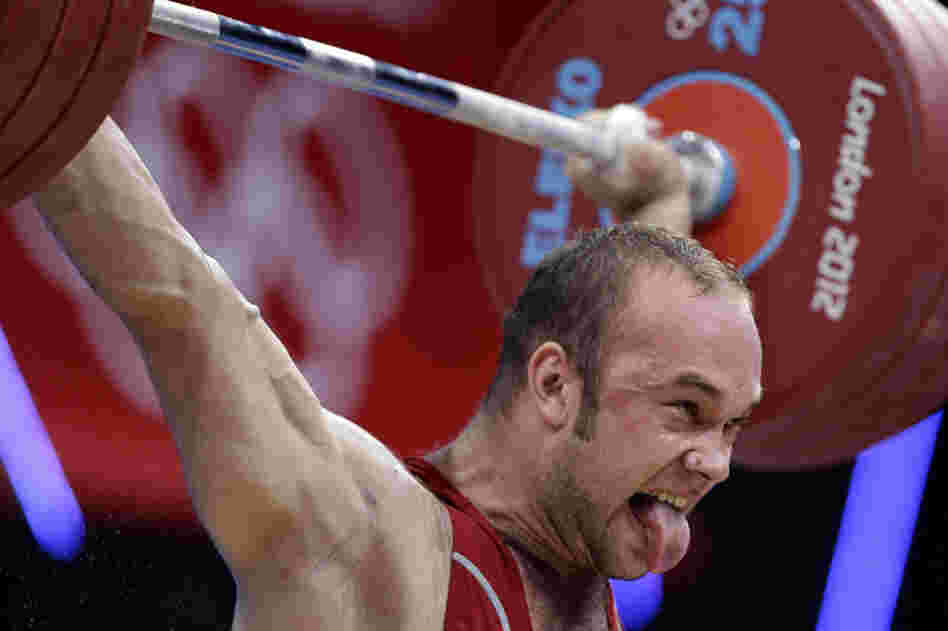 Ruslan Nurudinov of Uzbekistan competes during the men's 105kg weightlifting competition. He finished fourth in the finals.