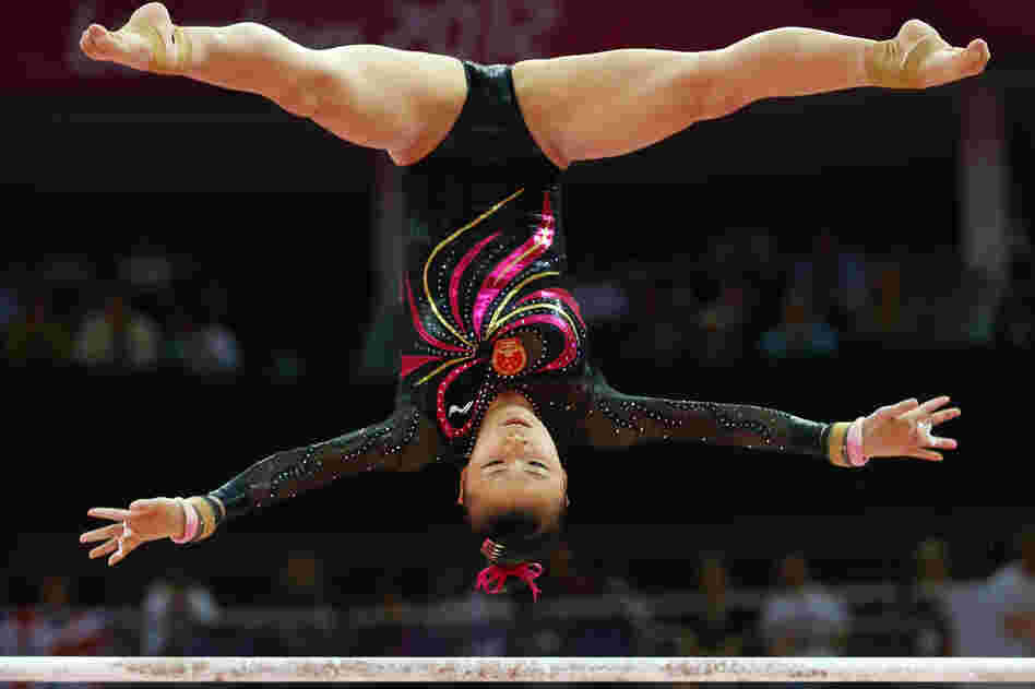 Gymnast He Kexin of China competes in the uneven bars final. She placed second in the event.