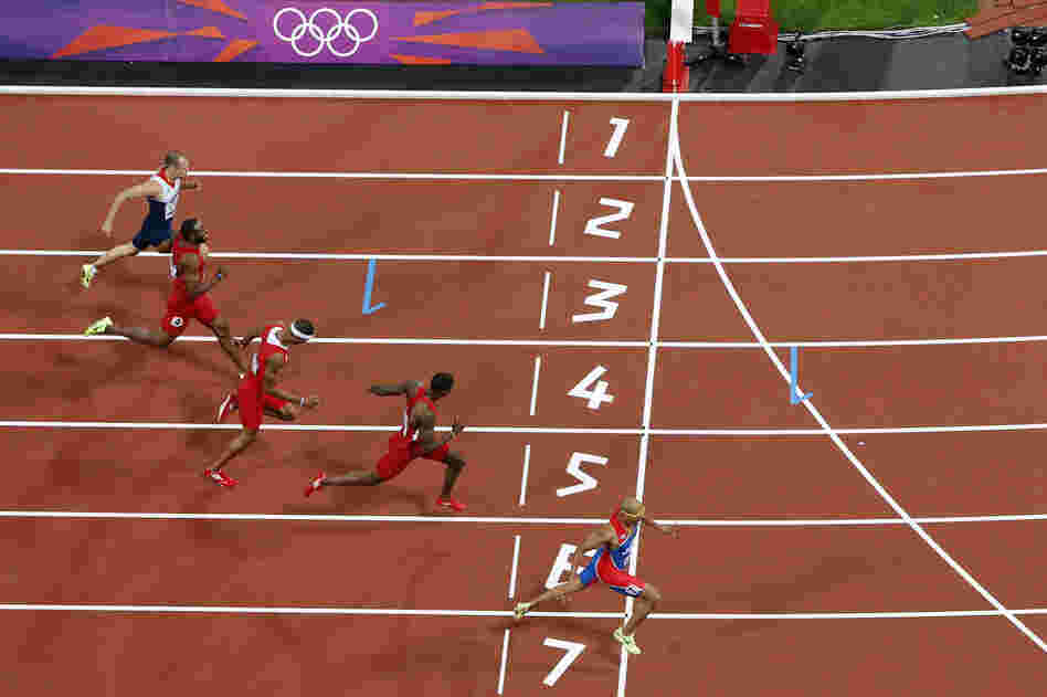 Felix Sanchez of the Dominican Republic wins gold ahead of U.S. hurdler Michael Tinsley and Puerto Rico's Javier Culson in the men's 400-meter hurdles final.