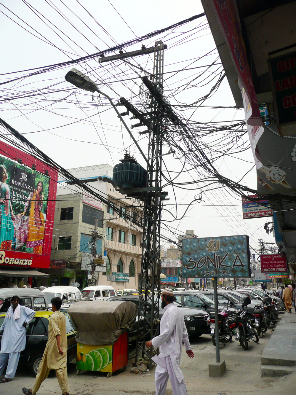 Tangled power lines in a busy shopping district in Rawalpindi.