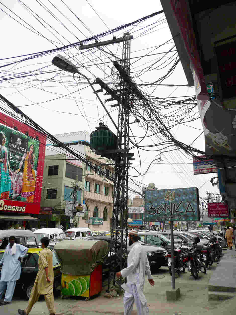 Tangled power lines in a busy shopping district in Rawalpindi.