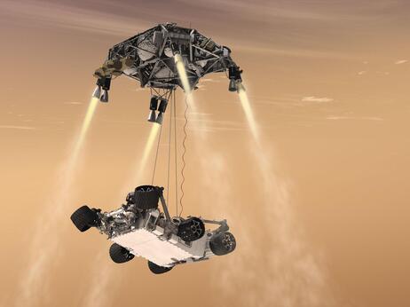 An artist's rendering shows a rocket-powered descent stage lowering the one-ton Curiosity rover to the Mars surface.