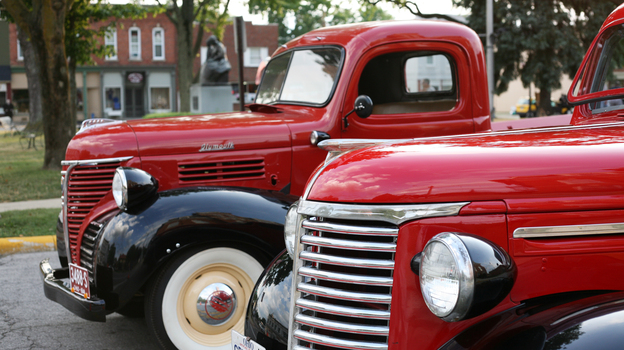 Antique trucks, including a 1937 Plymouth, on display at the weekly Cruisin' on the Square car show in Milan, Ohio. Classic car owners and enthusiasts gather each Tuesday evening through the summer to show off their cars or even find one to buy.