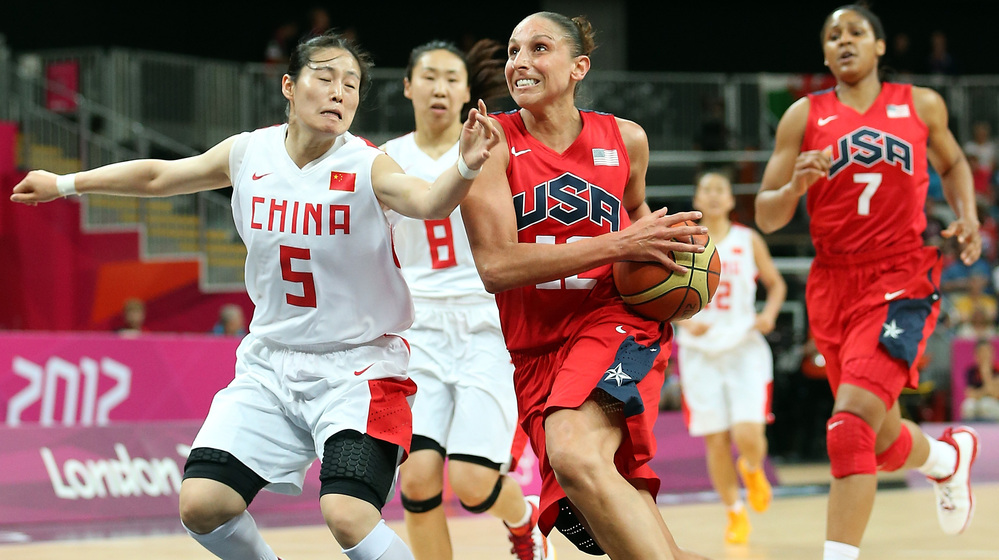 American Diana Taurasi drives to the basket past Xiaoyun Song #5 of China during their preliminary round match on Day 9 of the London 2012 Olympic Games.