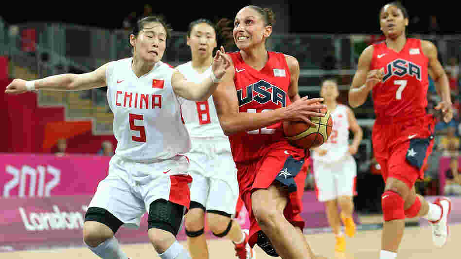 American Diana Taurasi drives to the basket past Xiaoyun Song #5 of China during their preliminary round match on Day 9 of the London 2012 Olympic Games.