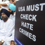 Activists protest near the U.S. Embassy in New Delhi after a gunman shot worshipers at a Sikh temple in Wisconsin on Sunday.