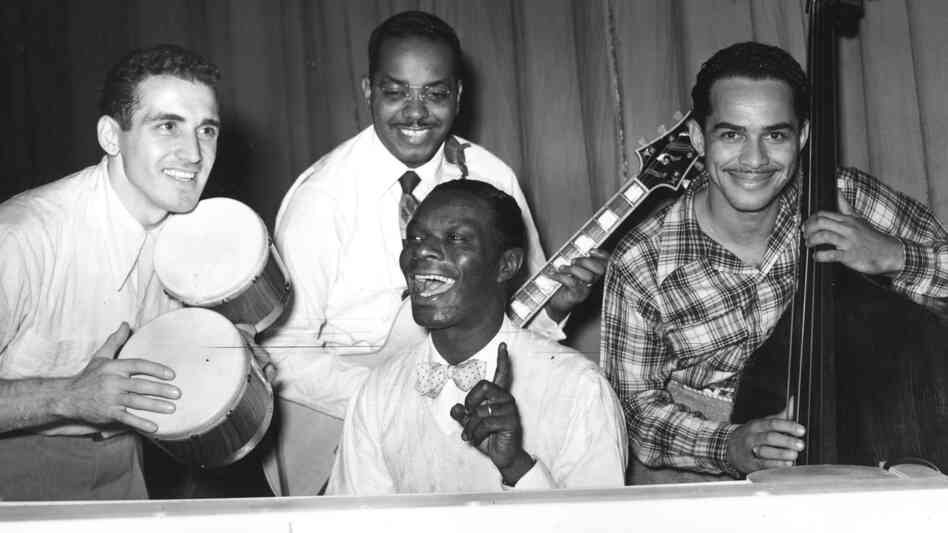 Nat King Cole (center) rehearses with his trio at the London Palladium in 1950.