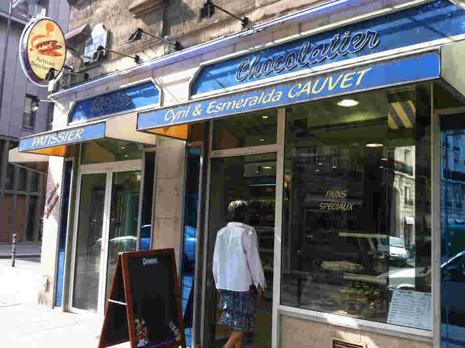 A woman walks into Boulangerie Cauvet in Paris, where they still make croissants from scratch.
