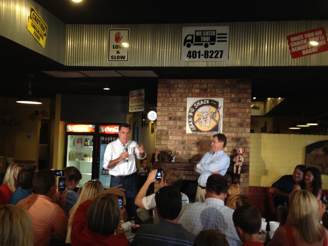 Romney speaks at Stepto's Bar-B-Q Shack on Saturday in Evansville, Ind., with U.S. Senate candidate Richard Mourdock (right).