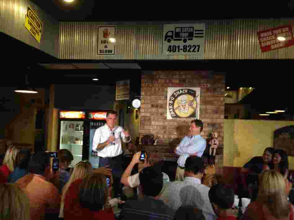 Romney speaks at Stepto's Bar-B-Q Shack on Saturday in Evansville, Ind., with U.S. Senate candidate Richard Mourdock (right).