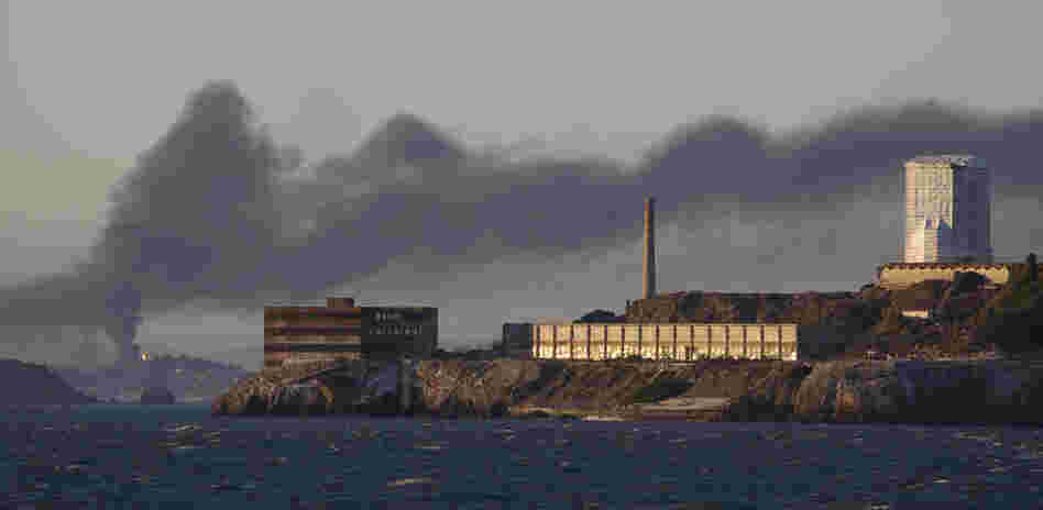 Smoke poured from the fire at a Chevron refinery in Richmond, Calif. Here, the plume rises behind Alcatraz Island in San Francisco.