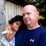 Mike Cannata with 2-year-old Bella. Mike and his wife, Barb, brought Bella home from Bulgaria this past spring after spending five years attempting to adopt.