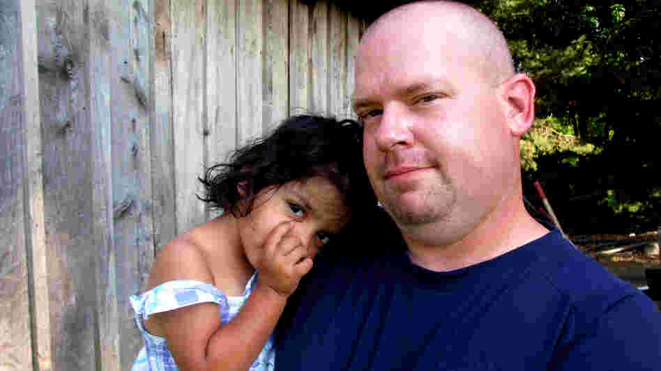 Mike Cannata with 2-year-old Bella. Mike and his wife, Barb, brought Bella home from Bulgaria this past spring after spending five years attempting to adopt. Mike Cannata with 2-year-old Bella. Mike and his wife, Barb, brought Bella home from Bulgaria this past spring after spending five years attempting to adopt.