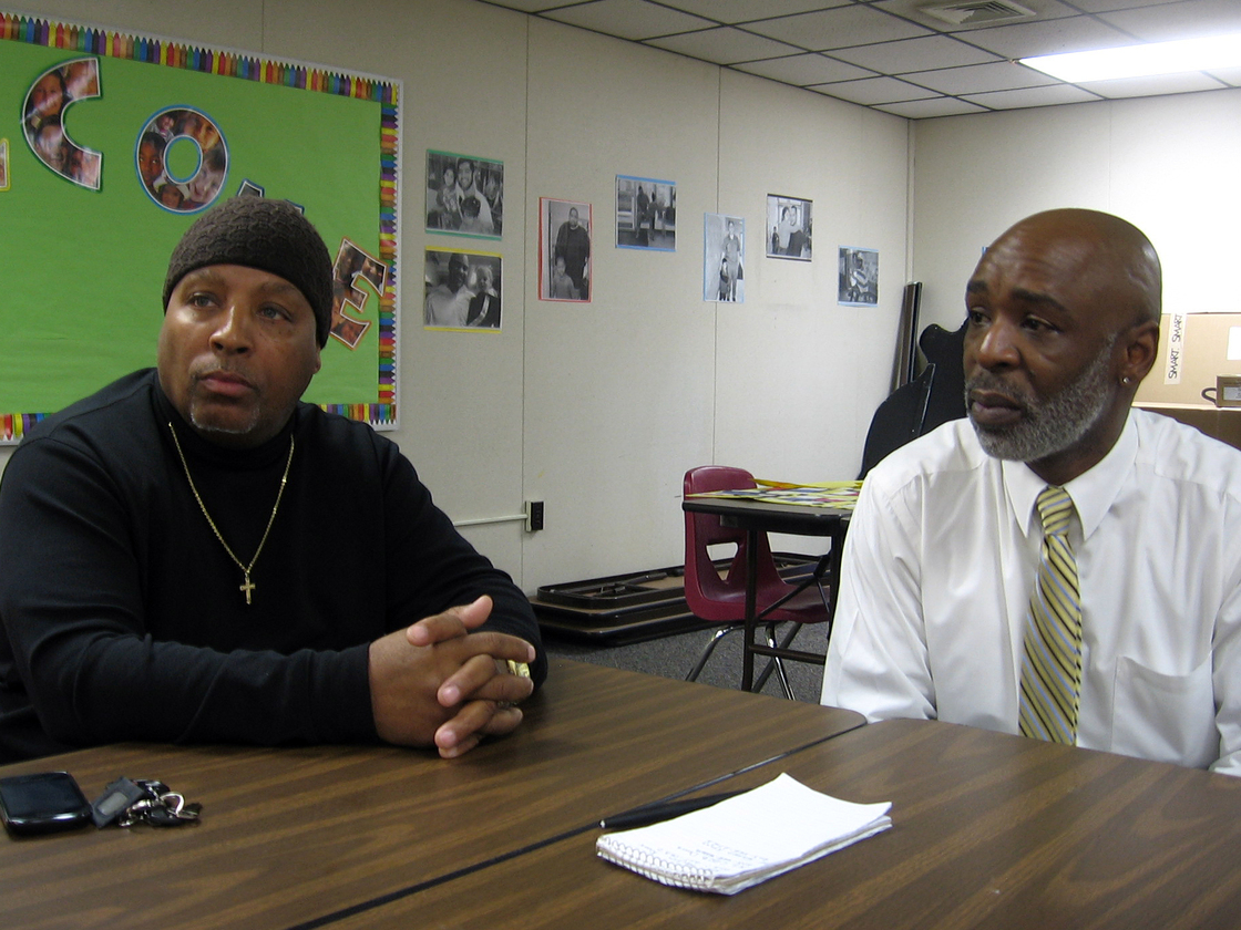 Rickie Knox (left) meets with Keith Young at New Haven's Head Start center. Knox comes here almost every day to be with his two grandchildren.