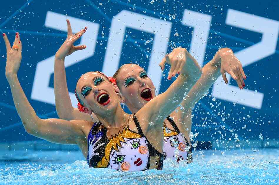 Russia's Natalia Ishchenko and Svetlana Romashina compete in the duets free routine final during the synchronized swimming competition. The pair won the event.