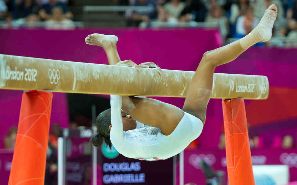 U.S. gymnast Gabrielle Douglas falls off the balance beam during the individual event finals, finishing in seventh place.
