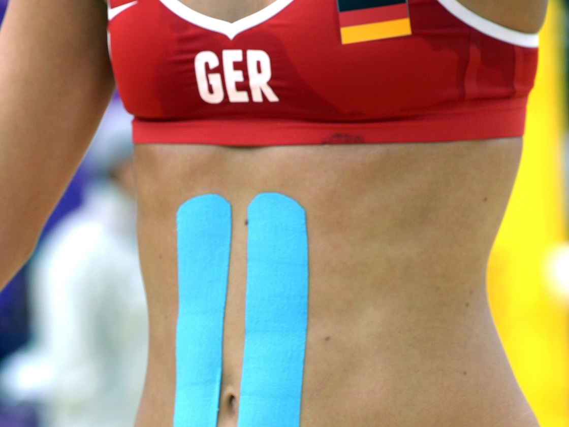 Germany's Laura Ludwing wears Kinesio tape during a women's beach volleyball match on July 31, 2012, during the London 2012 Olympic Games.