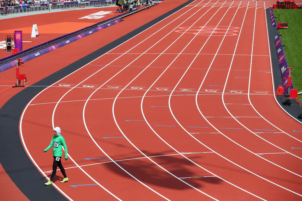 Sarah Attar of Saudi Arabia walks off the track after competing in the Women's 800m Round 1 Heats.