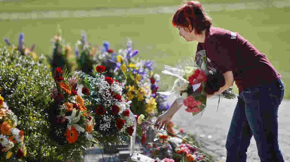 A visitor lays flowers on the Virginia Tech campus in Blacksburg, Va., on April 16, five years after a lone gunman killed 32 people. Many colleges formed threat assessment teams in the aftermath of the Virginia massacre. A visitor lays flowers on the Virginia Tech campus in Blacksburg, Va., on April 16, five years after a lone gunman killed 32 people. Many colleges formed threat assessment teams in the aftermath of the Virginia massacre.