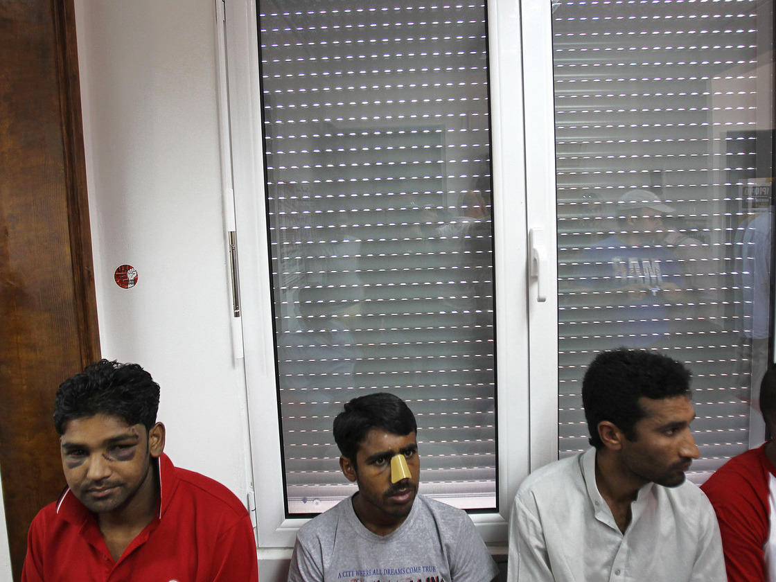 Immigrants at a news conference in Athens on June 21 say they were attacked by members of the extreme-right Golden Dawn party. United Against Racism and Fascist Violence Movement, an immigrants-support group, says Golden Dawn is behind attacks on hundreds of immigrants to Greece.