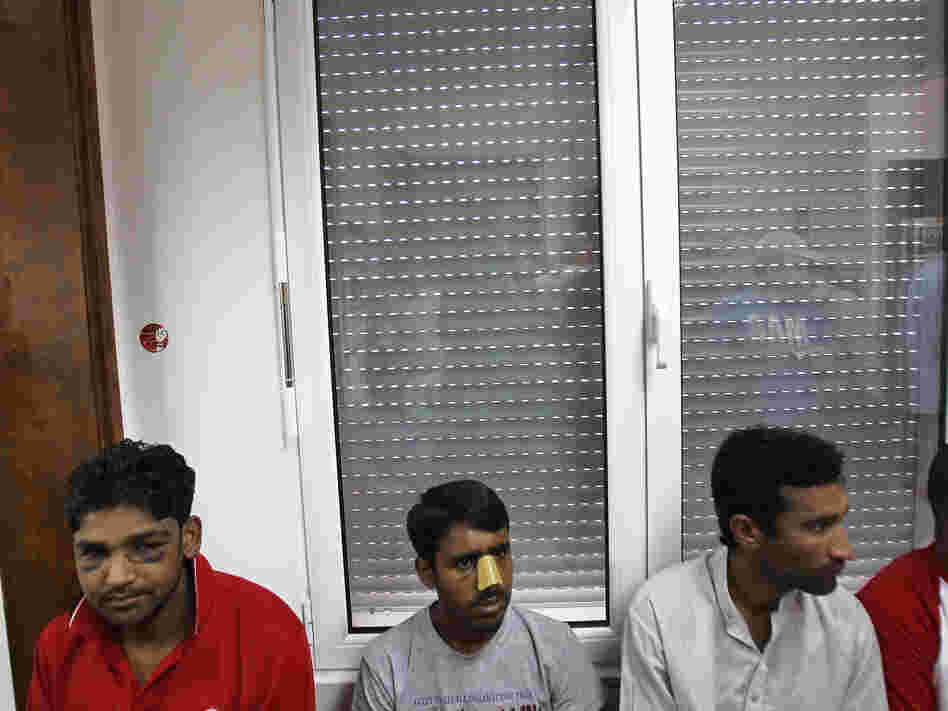 Immigrants at a news conference in Athens on June 21 say they were attacked by members of the extreme-right Golden Dawn party. United Against Racism and Fascist Violence Movement, an immigrants-support group, says Golden Dawn is behind attacks on hundreds of immigrants to Greece.
