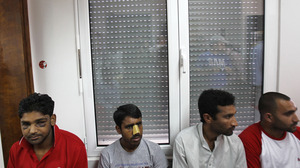 Immigrants at a news conference in Athens on June 21 say they were attacked by members of the extreme-right Golden Dawn party. United Against Racism and Fascist Violence Movement, an immigrants-support group, says Golden Dawn is behind attacks on hundreds of immigrants to Greece.