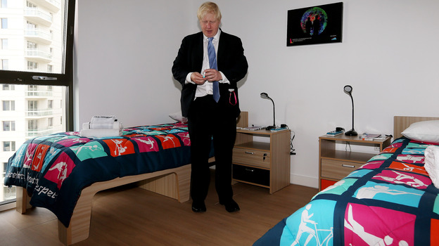 London Mayor Boris Johnson picks up a packet of Olympic branded condoms during a visit to the Olympic Village last month. Durex, the official Olympic supplier, has sent 150,000 condoms to the village. A bucket of rogue condoms has created a small controversy.
