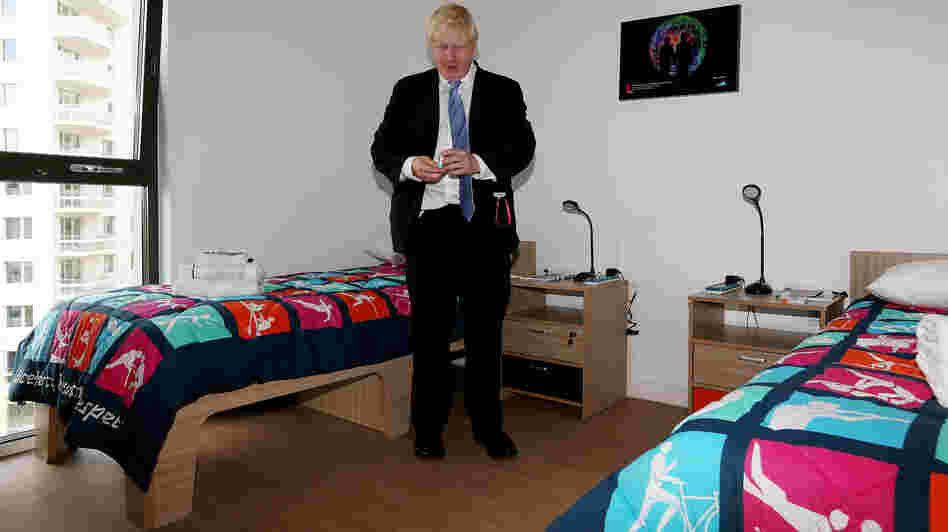 London Mayor Boris Johnson picks up a packet of Olympic branded condoms during a visit to the Olympic Village last month. Durex, the official Olympic supplier, has sent 150,000 condoms to the village. A bucket of rogue condoms has created a small controversy.