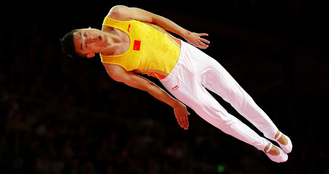 Chinese trampoline gold medalist Dong Dong competes in London. An analysis by Yahoo finds that China's Olympians outpace their U.S. counterparts in judged competitions, such as trampoline and diving.