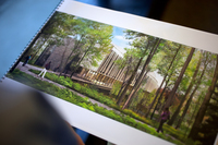 Architect Guy Maxwell holds a printout of his proposed design for the new Bridge Building at Vassar College in Poughkeepsie, N.Y.