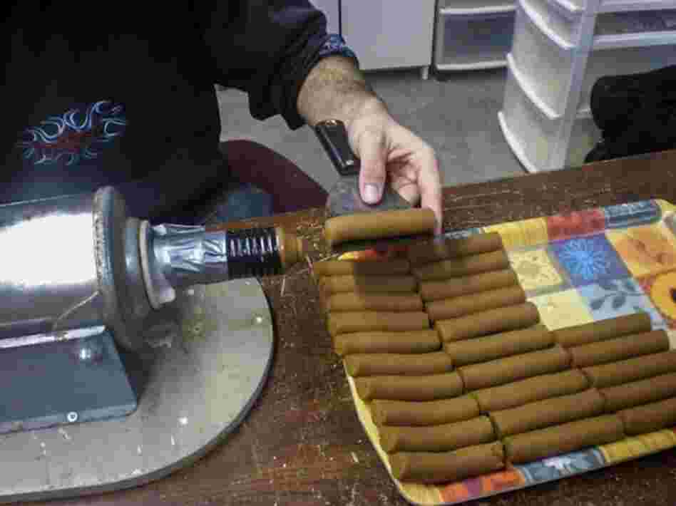 Soybean paste is extruded into 350 gram segments for testing in toilets.