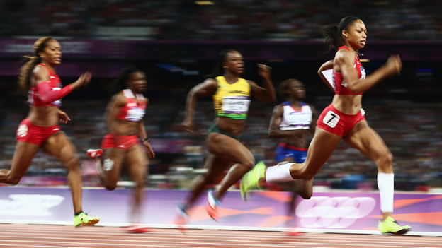 American sprinter Allyson Felix leads the field on her way to winning the women's 200 meters gold medal in London's Olympic Stadium.