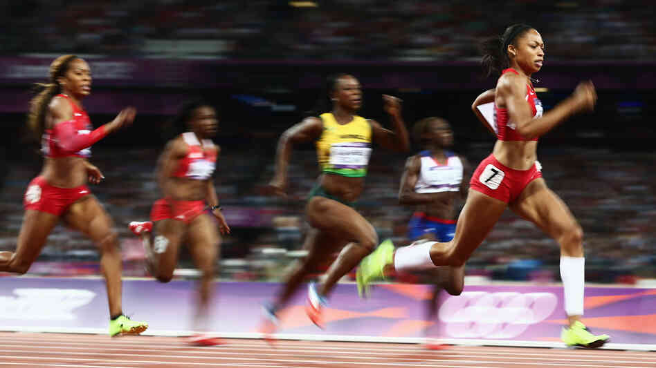 American sprinter Allyson Felix leads the field on her way to winning the women's 200 meters gold medal in London's Olympic Stadium.