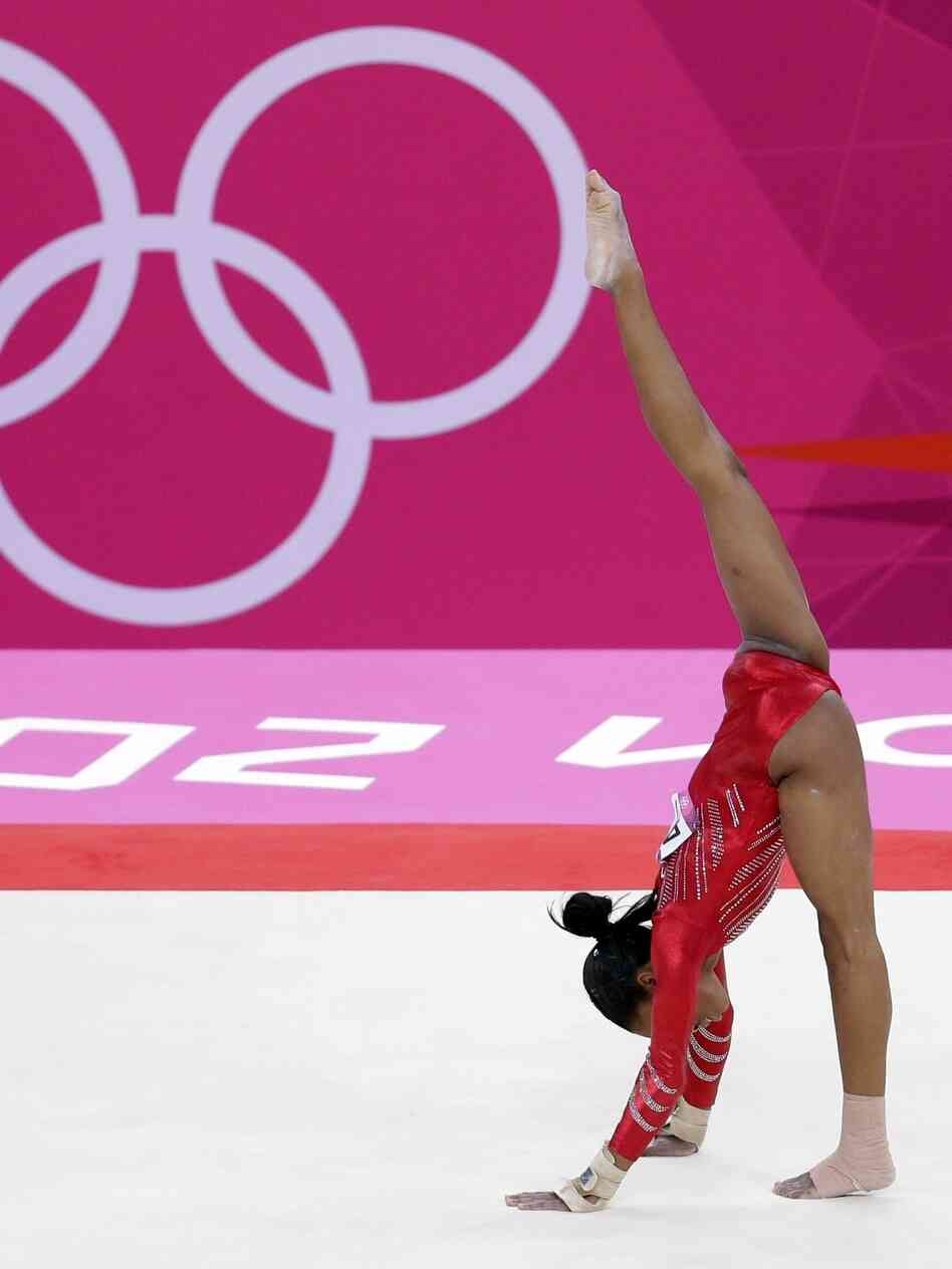 Gabrielle Douglas performs on the floor during the women's team final in London.
