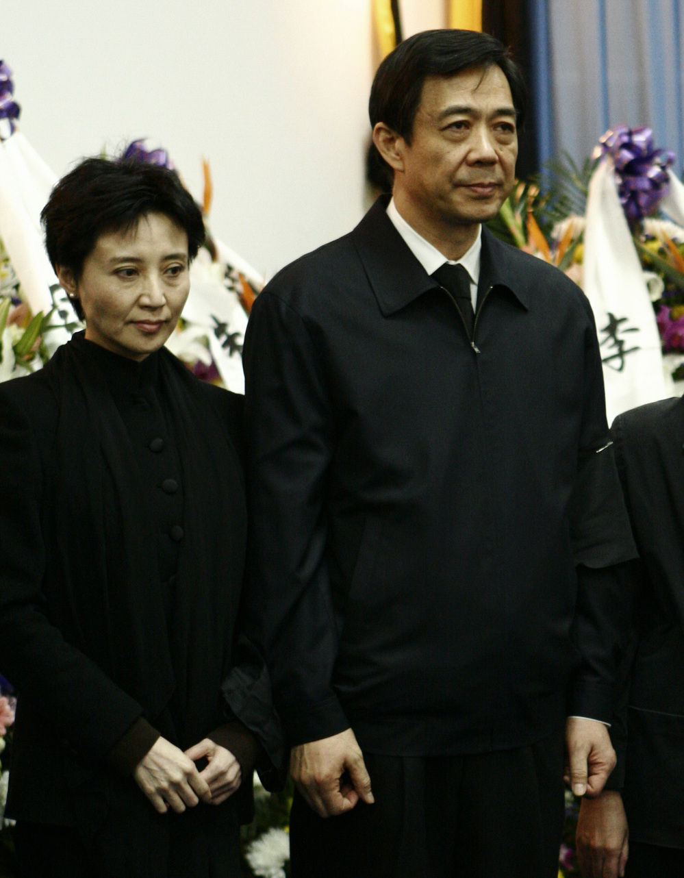 Gu Kailai, the wife of disgraced Chinese politician Bo Xilai, will stand trial on charges related to the murder of British businessman Neil Heywood. Here, the couple is shown in 2007 attending Bo's father's funeral.