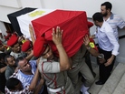 In Cairo on Tuesday, Egyptian Army military policemen carried the coffin of one of the 16 border guards killed during an attack on a crossing post in the northern Sinai on Sunday. In Cairo on Tuesday, Egyptian Army military policemen carried the coffin of one of the 16 border guards killed during an attack on a crossing post in the northern Sinai on Sunday.