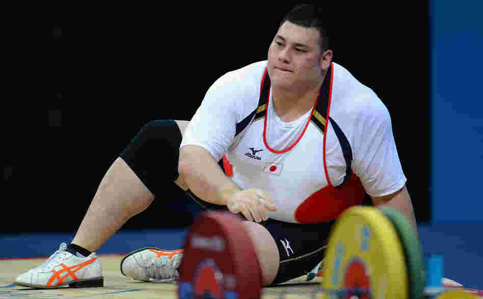 Weightlifter Kazuomi Ota of Japan takes a moment after failing to lift the required weight in the men's +105kg  final in London. At 6 feet and 324 pounds, Ota is one of the largest Olympians.